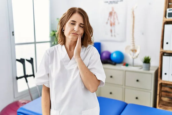 Middle Age Physiotherapist Woman Working Pain Recovery Clinic Touching Mouth — Fotografia de Stock