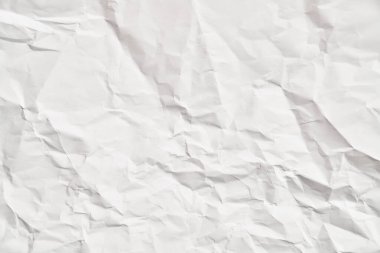 Kırışıklıkları olan beyaz buruşuk kağıt dokusu. Hasarlı ve yırtık çarşaf