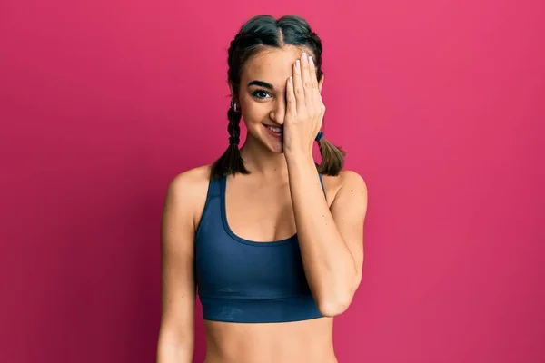 Young Brunette Girl Wearing Sportswear Braids Covering One Eye Hand — Stockfoto