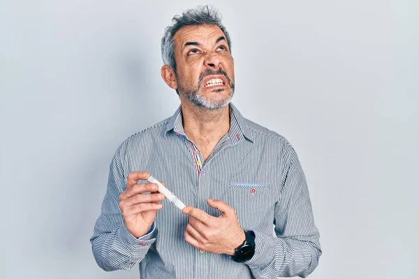 Handsome Middle Age Man Grey Hair Holding Glucometer Device Angry — Stockfoto