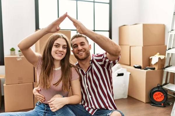 Young Caucasian Couple Doing House Symbol Arms Raised New Home — Stock Photo, Image