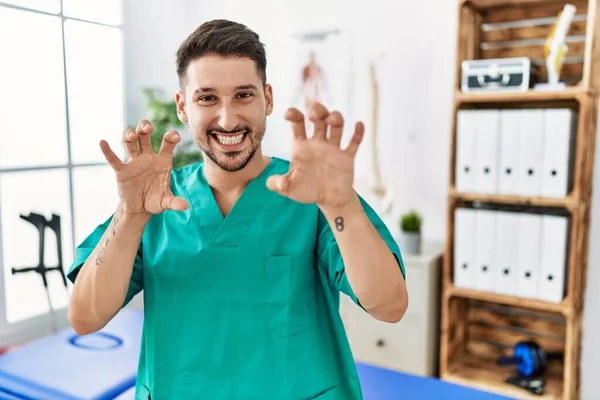 Young Physiotherapist Man Working Pain Recovery Clinic Smiling Funny Doing — Stok fotoğraf
