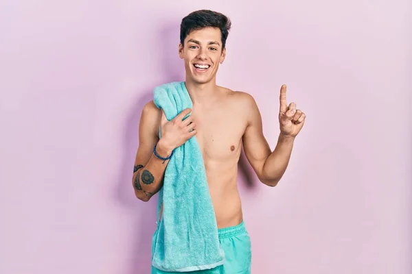 Young Hispanic Man Wearing Swimwear Towel Smiling Idea Question Pointing — Stock Photo, Image