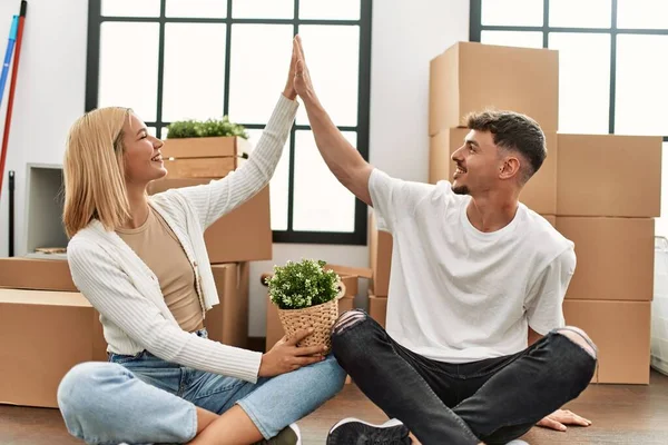 Young Caucasian Couple Smiling Happy High Five Sitting New Home — Stock Photo, Image