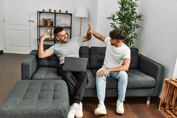 Two Hispanic Men Couple Using Laptop High Five Hands Raised — Stock Photo, Image