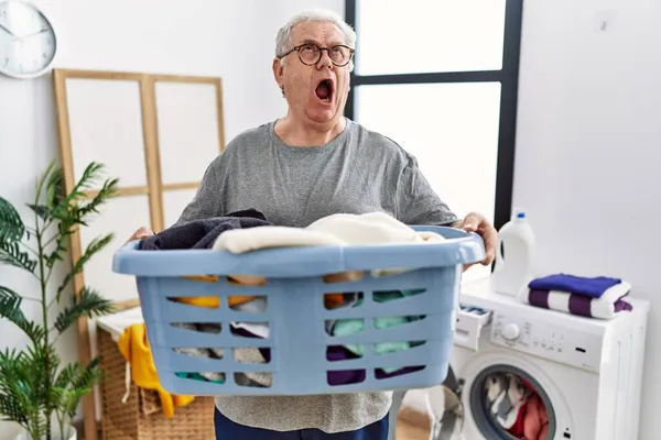 Senior Caucasian Man Holding Detergent Bottle Laundry Room Angry Mad — Stock Photo, Image