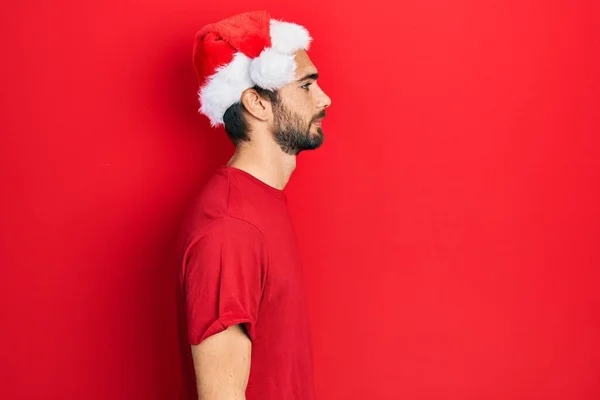 Giovane Uomo Ispanico Indossa Cappello Natale Cercando Lato Posa Profilo — Foto Stock