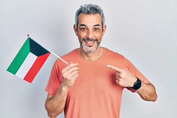 Handsome Middle Age Man Grey Hair Holding Kuwait Flag Smiling — 스톡 사진