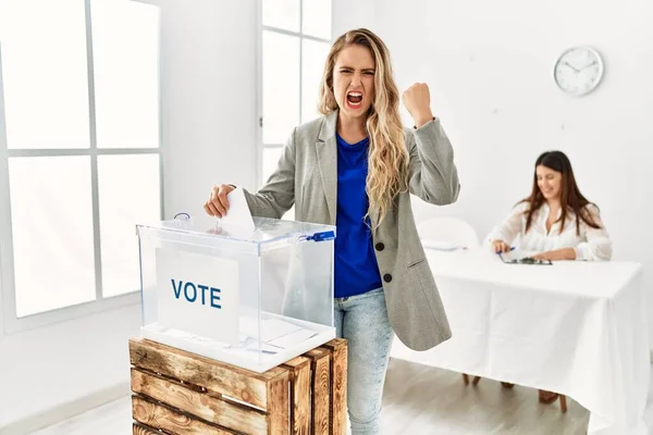 Young Blonde Woman Voting Putting Envelop Ballot Box Annoyed Frustrated — Stock Photo, Image