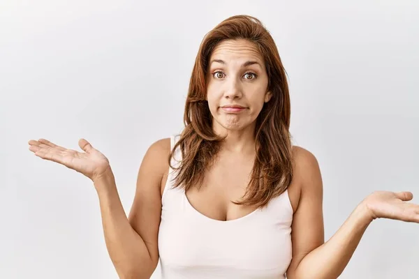 Middle Age Hispanic Woman Standing Isolated Background Clueless Confused Expression — Stock Photo, Image