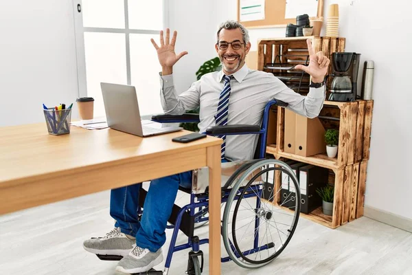 Middle Age Hispanic Man Working Office Sitting Wheelchair Showing Pointing — Stock Photo, Image