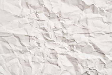 Kırışıklıkları olan beyaz buruşuk kağıt dokusu. Hasarlı ve yırtık çarşaf