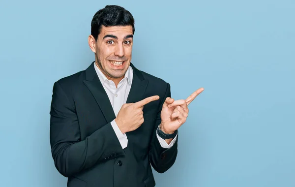 Handsome Hispanic Man Wearing Business Clothes Pointing Aside Worried Nervous — Stockfoto