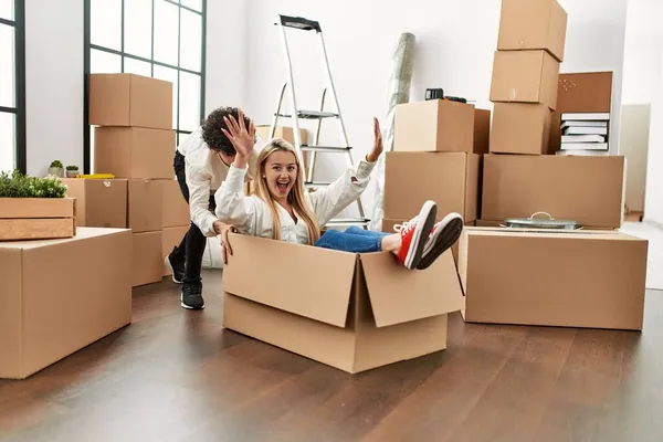 Young Beautiful Couple Smiling Happy Playing Using Cardboard Box Car — Stock Photo, Image