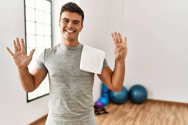 Young Hispanic Man Wearing Sportswear Towel Gym Showing Pointing Fingers — Fotografia de Stock