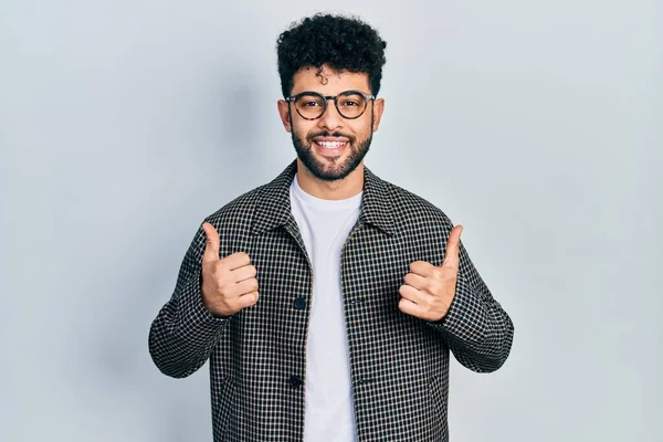 Young Arab Man Beard Wearing Glasses Success Sign Doing Positive — Stock Fotó