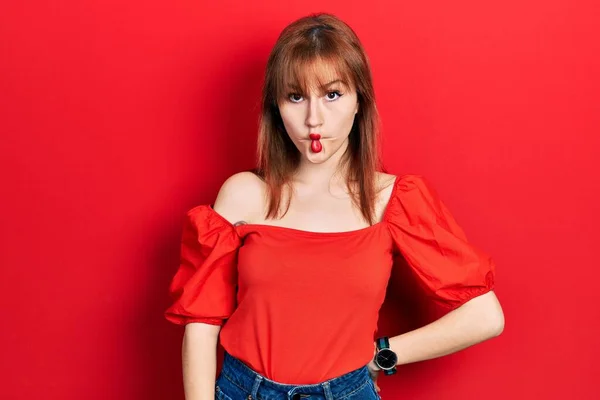 Redhead Young Woman Wearing Casual Red Shirt Making Fish Face — Stock Photo, Image