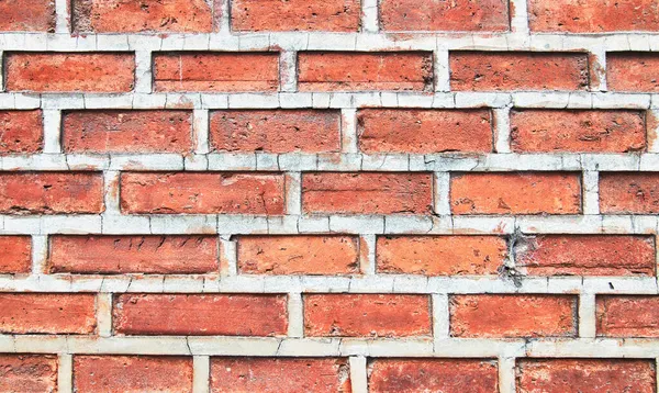 Çatlak kiremitler ve çimentoyla tuğla duvar dokusu. Klasik tuğla duvar yüzey arkaplanı