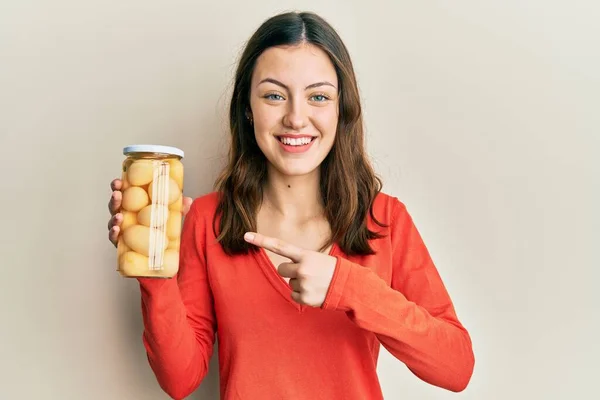 Young Brunette Woman Holding Bottle Boiled Potatoes Smiling Happy Pointing — Stockfoto