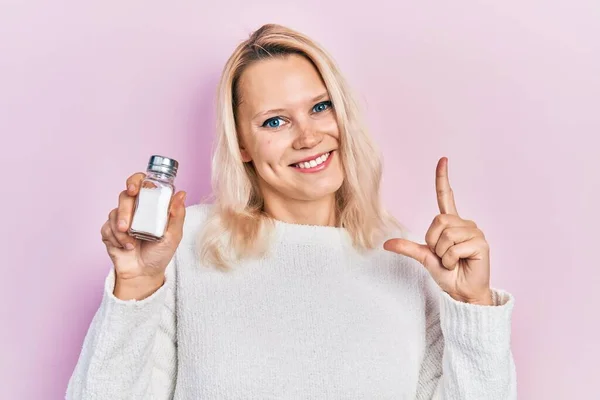 Beautiful Caucasian Blonde Woman Holding Salt Smiling Idea Question Pointing — Stockfoto