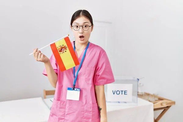 Young Asian Nurse Woman Political Campaign Election Holding Spain Flag — Stockfoto