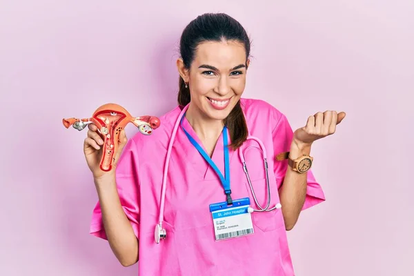 Young Brunette Doctor Woman Holding Anatomical Model Female Genital Organ — Fotografia de Stock