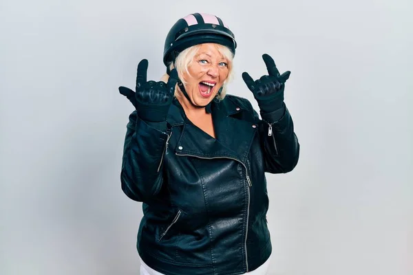 Middle Age Blonde Woman Holding Motorcycle Helmet Shouting Crazy Expression — Stock Photo, Image