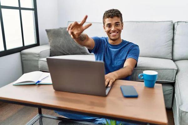 Young Handsome Hispanic Man Using Laptop Sitting Floor Smiling Looking — стоковое фото
