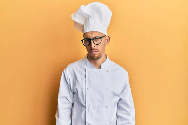 Bald Man Beard Wearing Professional Cook Uniform Skeptic Nervous Frowning —  Fotos de Stock