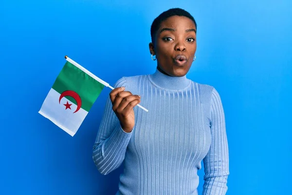 Young African American Woman Holding Algeria Flag Scared Amazed Open — Stock Fotó