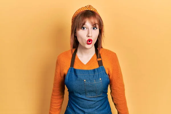 Redhead Young Woman Wearing Apron Scared Amazed Open Mouth Surprise — Fotografia de Stock