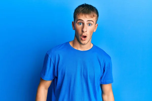 Young Caucasian Man Wearing Casual Blue Shirt Afraid Shocked Surprise — Stockfoto