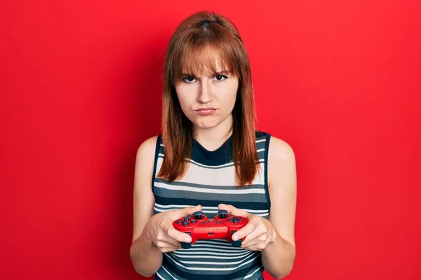 Redhead Young Woman Playing Video Game Holding Controller Skeptic Nervous — Stock Photo, Image