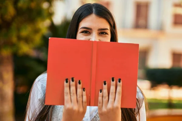 Young Hispanic Woman Smiling Happy Covering Face Book City — Stock Photo, Image