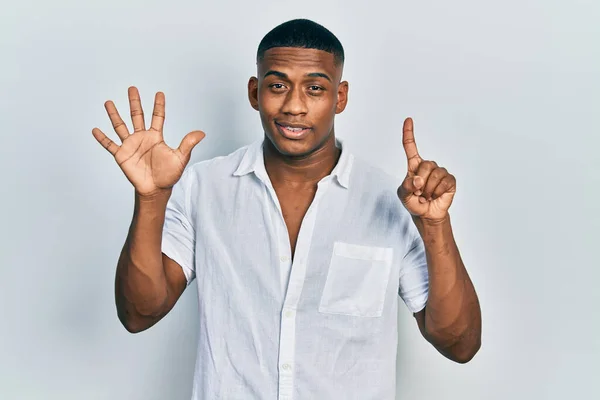 Young Black Man Wearing Casual White Shirt Showing Pointing Fingers — Stockfoto