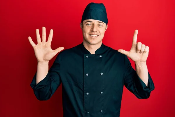 Handsome Young Man Wearing Professional Cook Uniform Hat Showing Pointing — Foto Stock