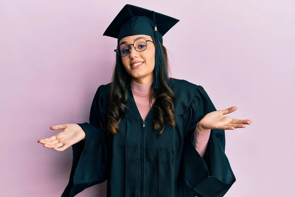 Young Hispanic Woman Wearing Graduation Cap Ceremony Robe Clueless Confused — Stockfoto