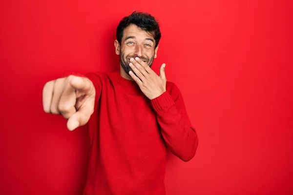 Handsome Man Beard Wearing Casual Red Sweater Laughing You Pointing — Zdjęcie stockowe