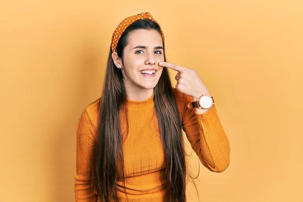 Young Brunette Teenager Wearing Casual Yellow Sweater Pointing Hand Finger — Stockfoto