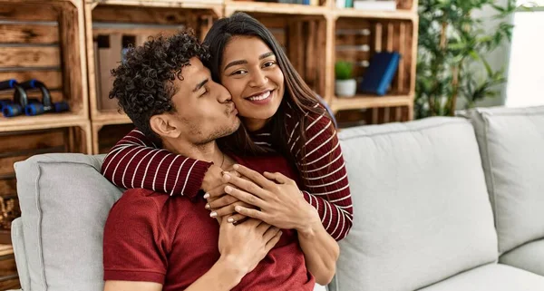 Young Latin Couple Smiling Happy Hugging Sitting Sofa Home — Stock Photo, Image