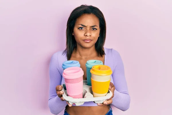 Young African American Girl Holding Tray Take Away Coffee Skeptic — Stock Photo, Image