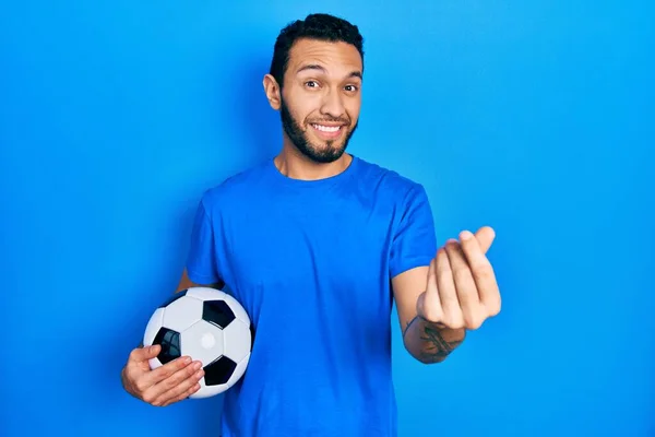 Hispanic Man Beard Holding Soccer Ball Doing Money Gesture Hands — Foto Stock