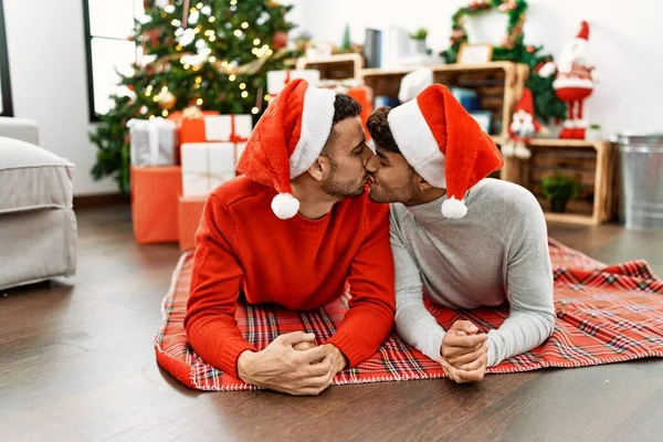 Two Hispanic Men Couple Kissing Lying Christmas Tree Home — Stock Fotó
