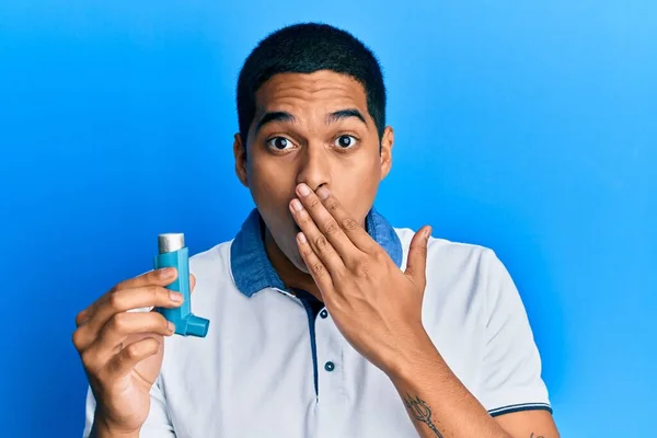 Young Handsome Hispanic Man Holding Medical Asthma Inhaler Covering Mouth — Stock Photo, Image