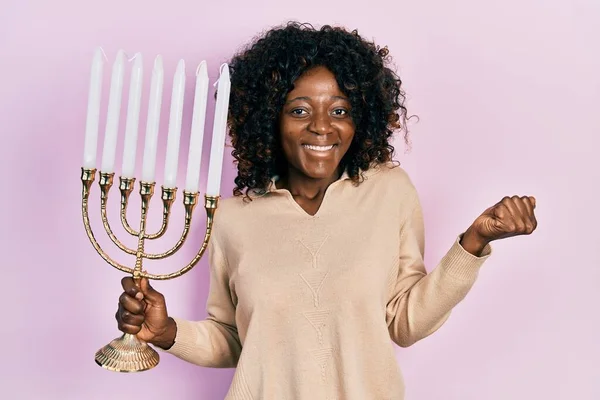 Young African American Woman Holding Menorah Hanukkah Jewish Candle Screaming — Stock Photo, Image