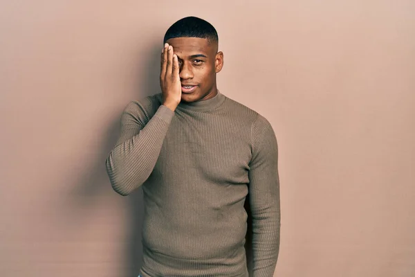 Young Black Man Wearing Casual Turtleneck Sweater Covering One Eye — Fotografia de Stock