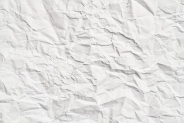 Kırışıklıkları olan beyaz buruşuk kağıt dokusu. Hasarlı ve yırtık çarşaf