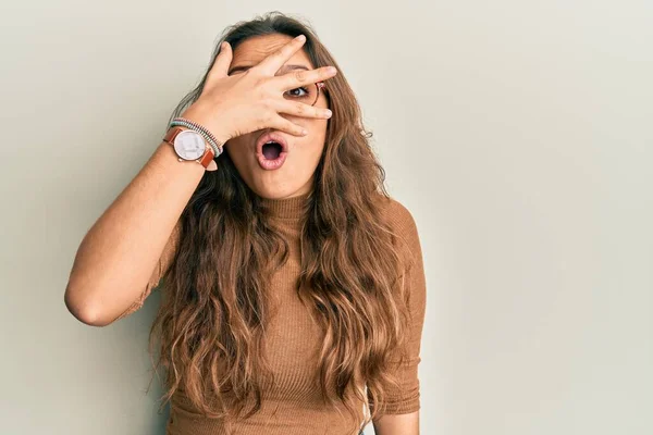 Young Hispanic Girl Wearing Casual Clothes Glasses Peeking Shock Covering — Stock Photo, Image