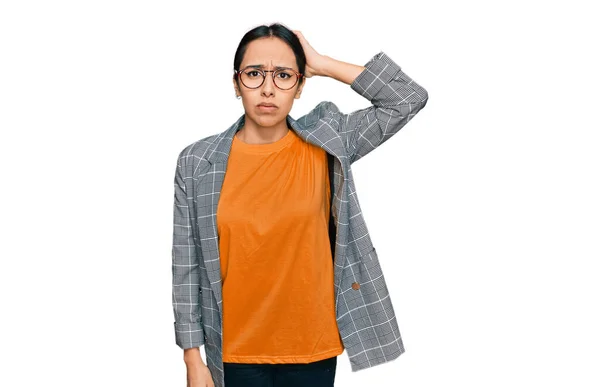 Young Hispanic Girl Wearing Business Jacket Glasses Confuse Wonder Question — Stockfoto