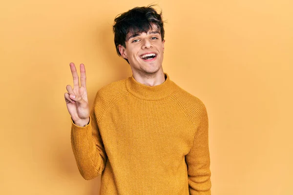 Handsome Hipster Young Man Wearing Casual Yellow Sweater Smiling Looking — Fotografia de Stock